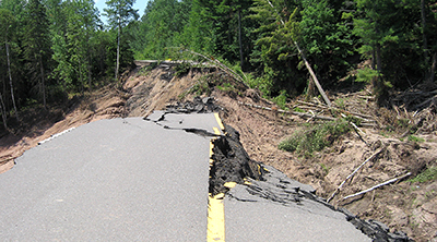 Photo of flood damage to Hwy 210.